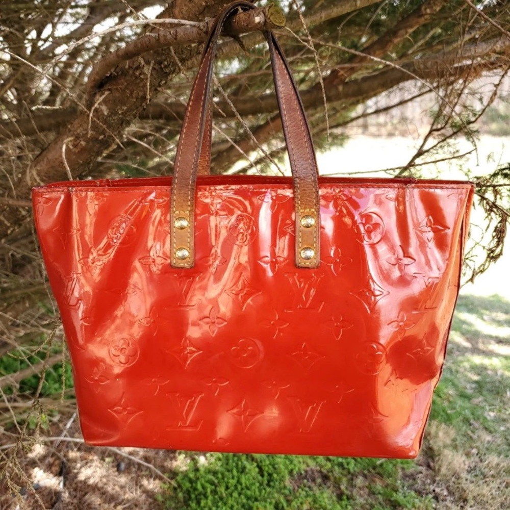 Authentic Louis Vuitton Red Vernis small purse.